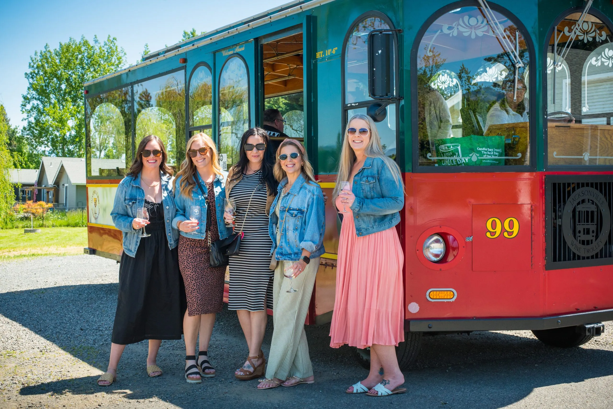 Friends in front of the red Jacksonville trolley.